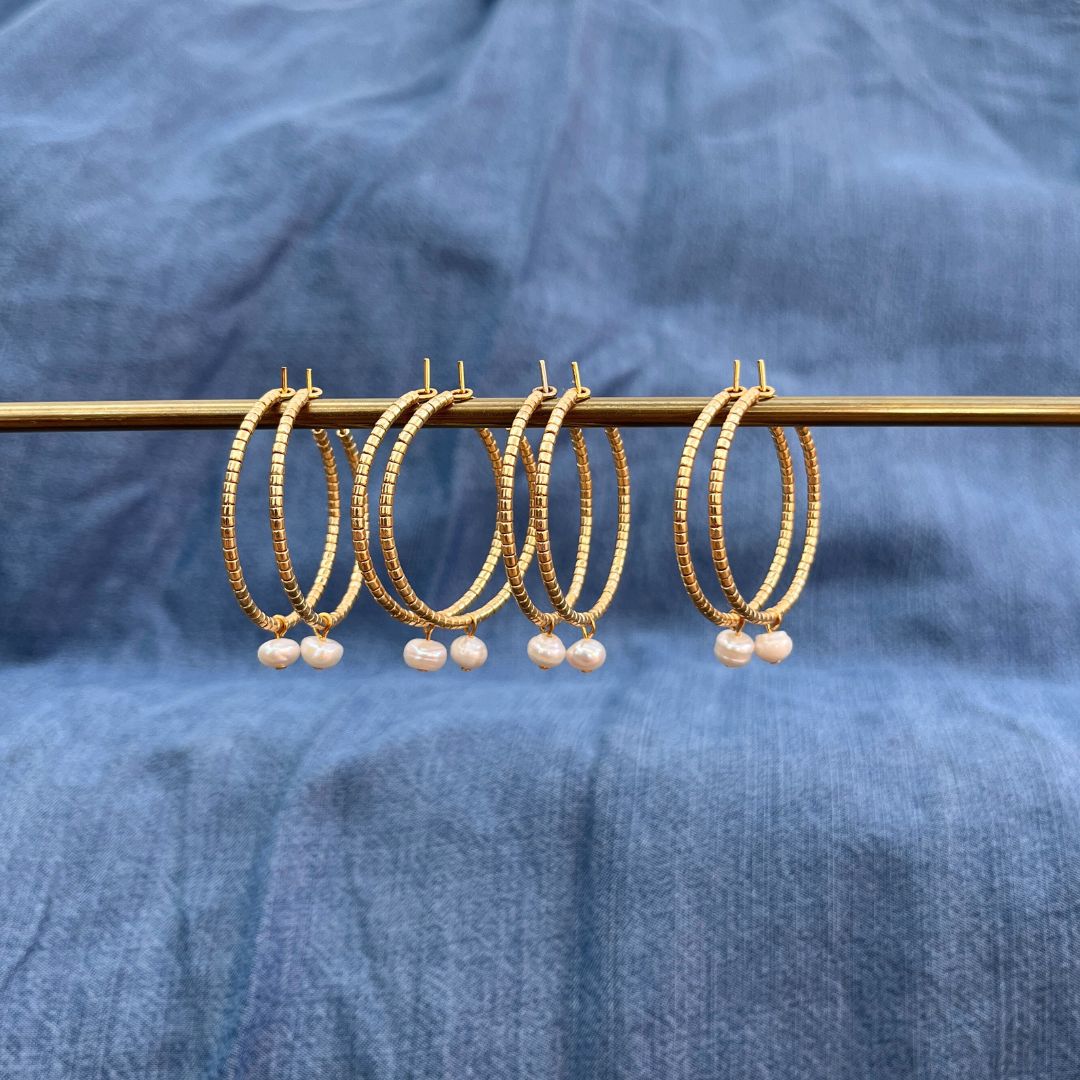 Hoop earrings made with gold Miyuki beads and pearls